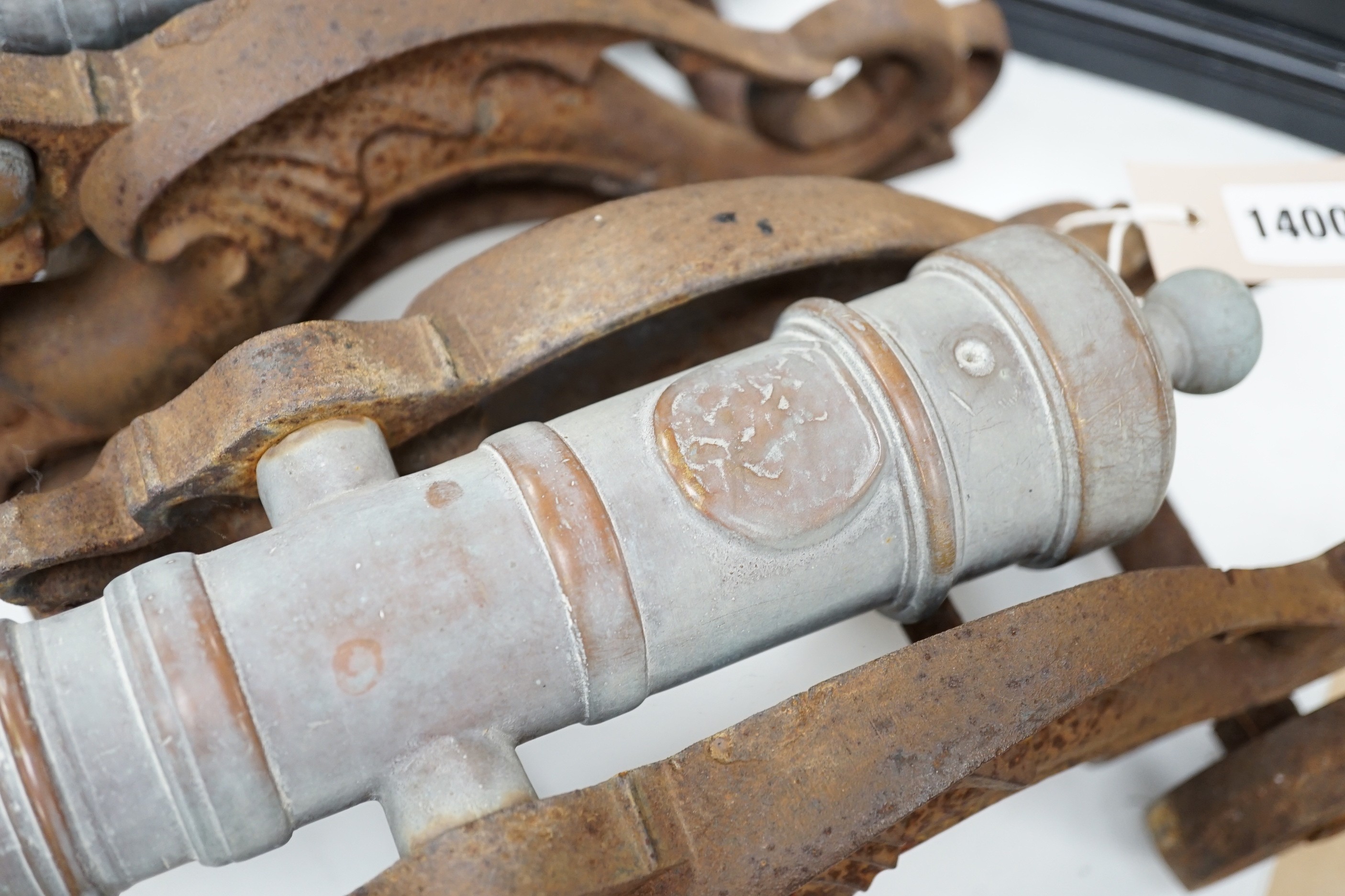 A pair of brass and cast iron model cannons. 45cm wide